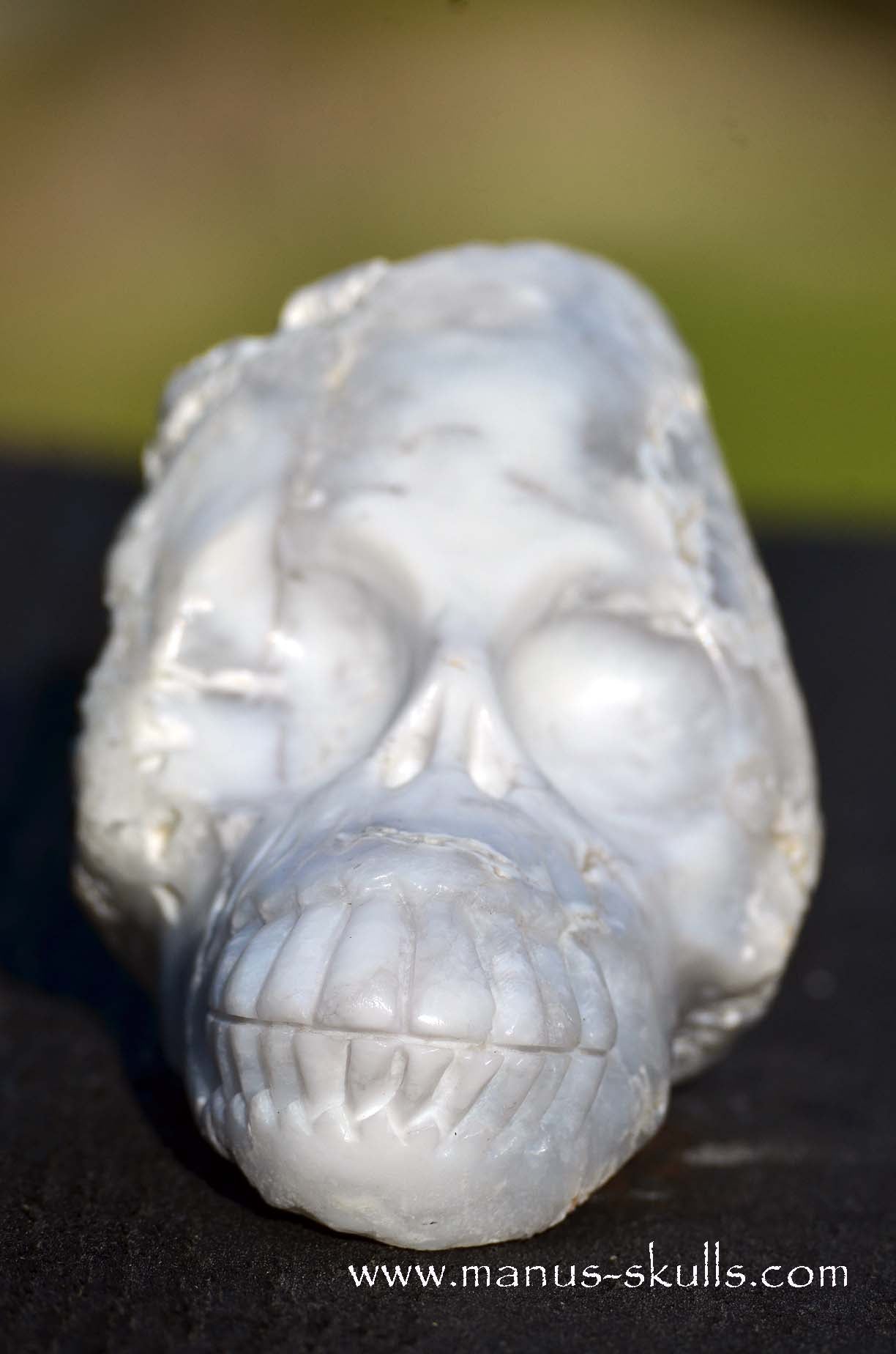 Manus skulls unique Crystal Carvings handmade skulls dragons pendants preseli bluestone tribals spiritual meaning Cacholong Opal Milk