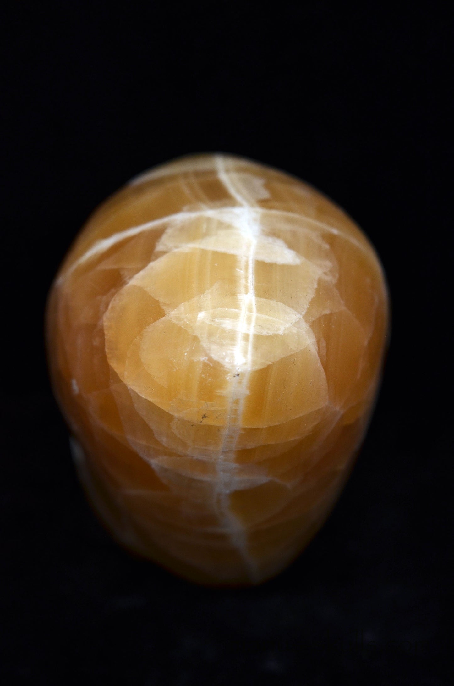 Honey Calcite Conehead Manus Skull.
