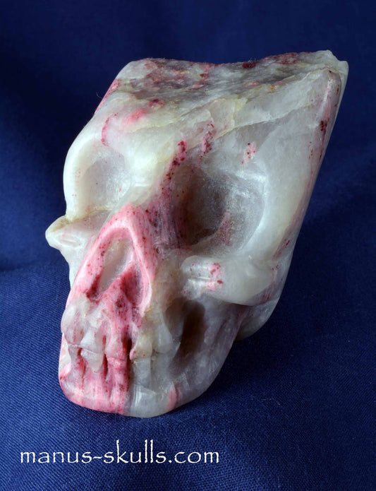 Thulite in Quartz Skull